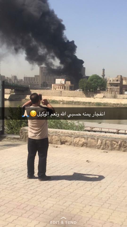 Photo posted on social media showing a black smoke rising from the site of the explosion in Baghdad, Iraq, May 30, 2017.